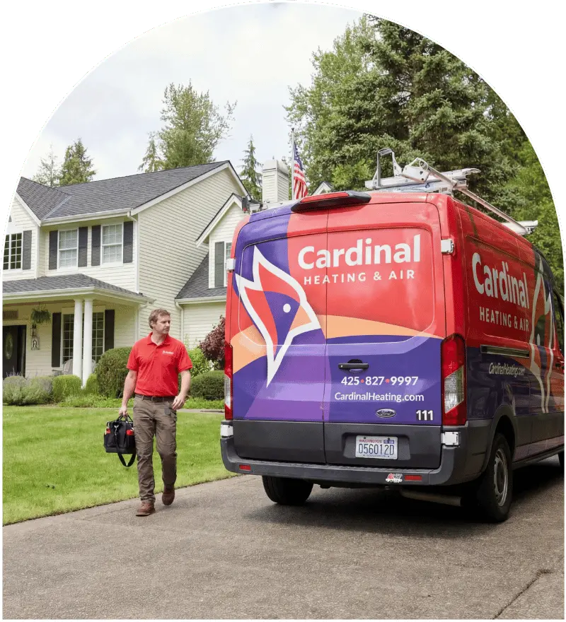 Cardinal Heating and Air service van arriving at a Greater Seattle home for HVAC service