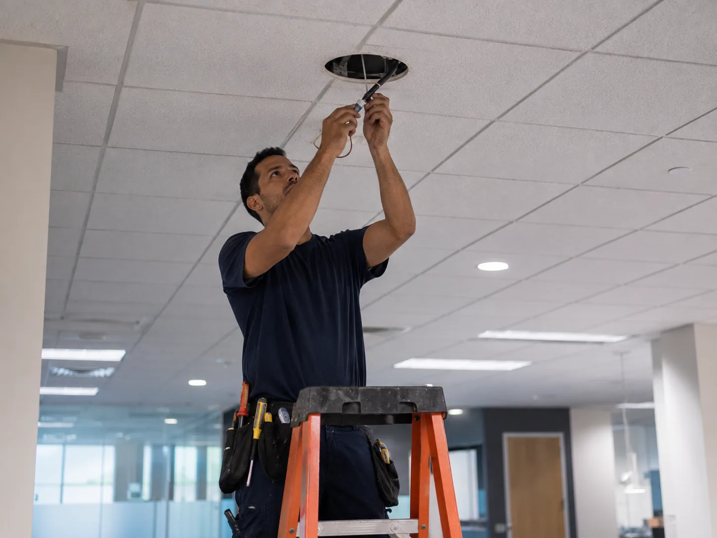 Electrical in Federal Way - WA being tested as a technician checks outlets in a living room