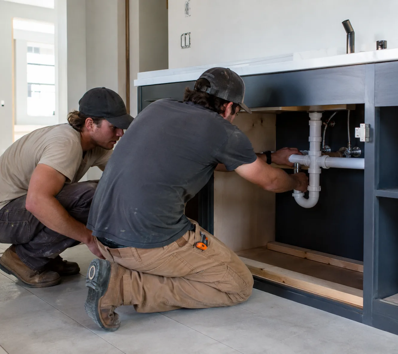 Crew measuring Plumbing for New Construction lines inside a Greater Seattle - WA residential build